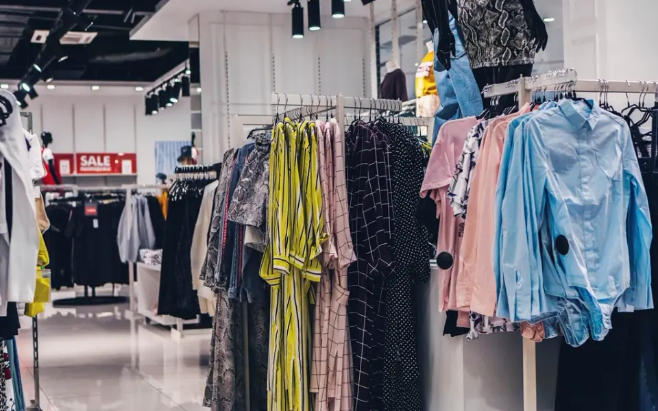 Racks of clothes in a shop